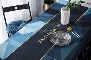 Detail of luxury velvet tablecloth with geometric patterns and golden text art