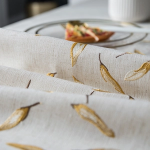 Macro detail of golden leaf embroidery on waterproof linen texture rectangular tablecloth