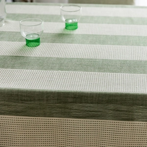 Linen stripe tablecloth in sage green and cream with decorative fringe edges