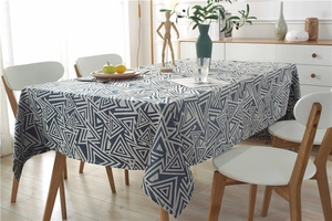 Detail of blue and beige geometric triangle jacquard texture on waterproof tablecloth