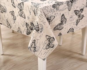 Detail of vintage French style tablecloth with butterfly print and Marseille typography