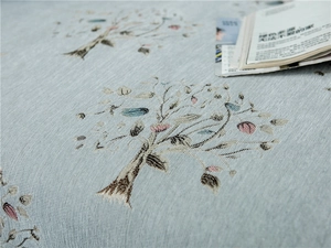 Macro view of thickened chenille fabric with jacquard tree pattern and leaf lace details