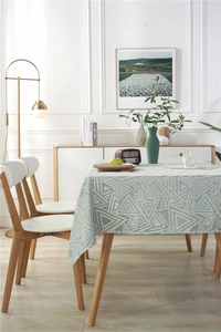 Detail showing high-quality jacquard weave with green and white geometric patterns