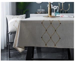 Close-up of geometric diamond embroidery on linen texture modern minimalist tablecloth