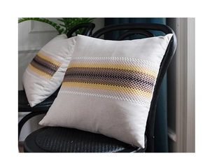 Close-up of gray cotton linen pillowcase with wave pattern weaving and textured fabric