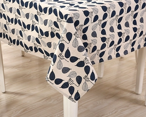 Detail shot of modern Nordic cotton linen tablecloth with elegant leaf patterns