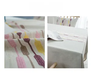 Detail of delicate geometric embroidery and premium stitching on linen table runner