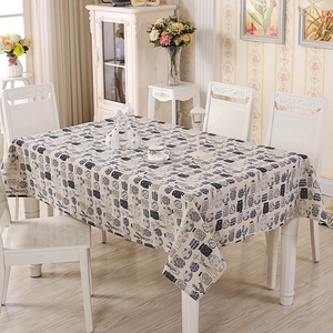 Detail of cotton linen tablecloth with hand-painted bottle and dried flower patterns
