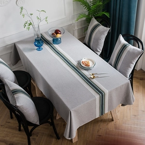 Modern grey cotton linen table runner with striped geometric pattern and matching pillow
