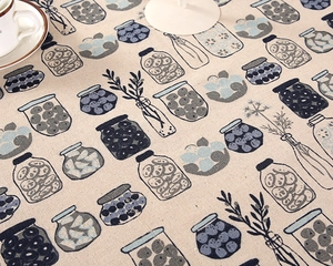 Detailed close-up of retro striped pattern on linen-cotton tablecloth in a cozy setting