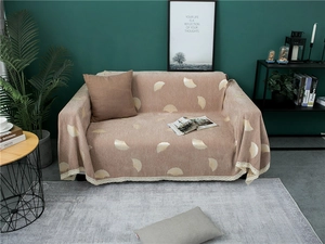 Close-up of thick chenille sofa cover with silver ginkgo leaves and white lace edge