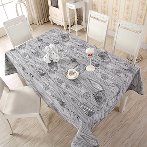 Detailed pattern of grey striped wood grain and concentric circles on cotton table cloth