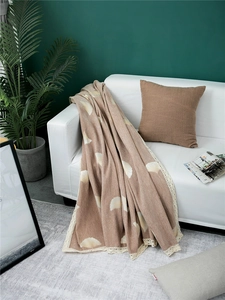 Thick chenille sofa cover detail featuring white ginkgo leaf patterns and beige crochet lace