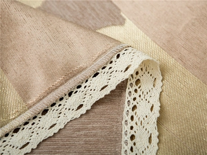 Macro view of thick chenille sofa cover showing leaf lace trim and woven texture