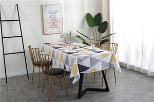 Detail of Nordic waterproof tablecloth with grey and yellow geometric triangle patterns