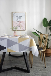 Detail of Nordic geometric triangle tablecloth with yellow and grey waterproof fabric