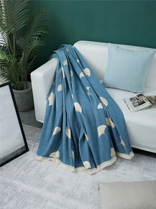 Blue chenille sofa cover with ivory ginkgo leaf pattern and delicate crochet lace edge
