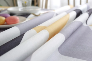 Close-up of waterproof fabric showing modern geometric patterns and thick textile texture