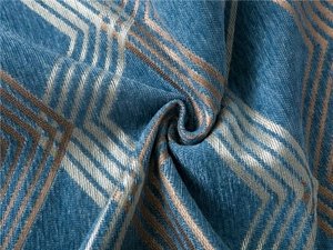Close-up of thick chenille fabric with golden geometric lines and soft velvet texture