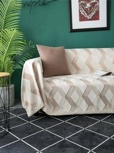 Detail of chenille sofa cover showing geometric lines and crochet lace edge texture