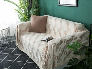 Detailed close-up of thickened chenille sofa cover with geometric diamond patterns and lace edge