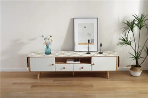 Close-up of chenille table runner with yellow geometric pattern on modern TV cabinet