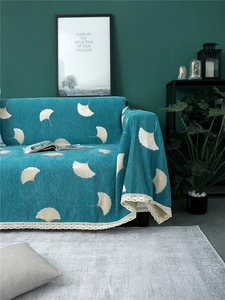 Teal chenille sofa cover with ginkgo leaf pattern and wide cream lace crochet edges