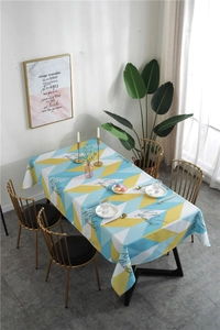 Close-up of waterproof geometric triangle tablecloth in yellow and blue Nordic style