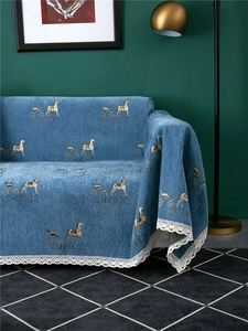 Detail of navy chenille sofa cover with carriage print and elegant lace trim edges