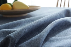 Close-up of blue faux linen tablecloth showing thick woven texture and fabric details
