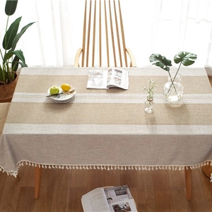 Linen blend table runner with beige stripes, white lace trim and fringe tassels