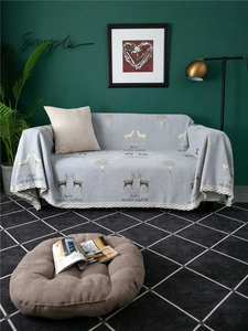 Detailed view of thick chenille sofa cover with elk pattern and crochet lace trim edge