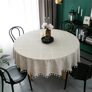 Beige round jacquard tablecloth with white grid pattern and elegant tassel fringe