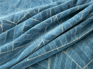 Macro view of thick blue chenille fabric texture with geometric pattern for sofa covers