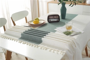 Close-up of waterproof table runner with herringbone texture and fringe detailing