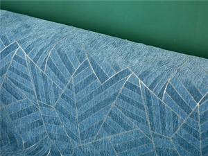 Detailed view of blue chenille sofa cover fabric with woven geometric jacquard patterns