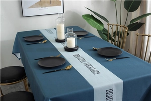Waterproof rectangular tablecloth with blue geometric print in a modern dining room setup
