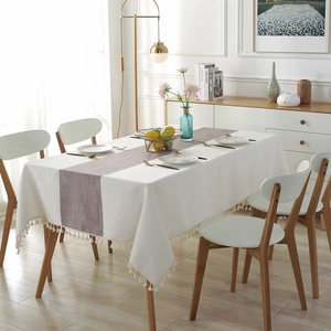 Waterproof modern table runner with chevron pattern and elegant tassels on off-white fabric