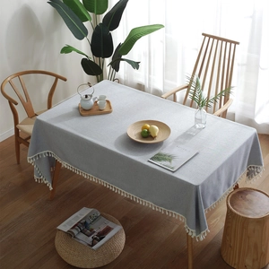 Minimalist light blue linen rectangular tablecloth with white tassel trim and fringe