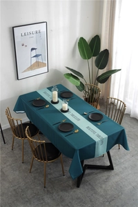 Detail of waterproof geometric tablecloth with Beautiful Tablecloth text and green stripe