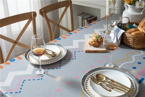 Detailed top view of grey-blue tablecloth with geometric prints and premium thick texture