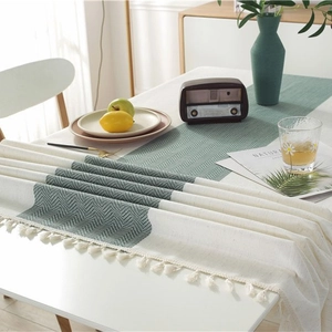 Waterproof minimalist table runner with dark green wavy pattern and elegant white tassels