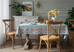 Macro shot of thick faux linen tablecloth with colorful geometric triangle patterns