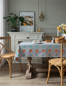 Close-up of thick cotton linen tablecloth with geometric patterns on gray fabric