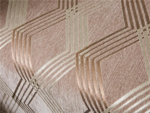 Detailed macro shot of thick chenille fabric with golden geometric diamond patterns
