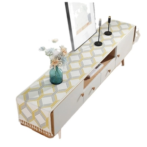 Modern geometric honeycomb table runner with yellow grey pattern and tassel fringe