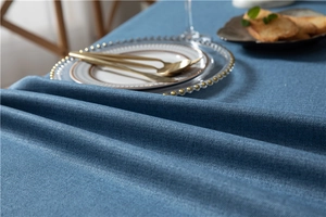 Detail of navy blue herringbone tablecloth with heavy cotton texture and premium drape
