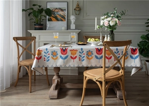 Close-up of thick linen-cotton tablecloth with floral tulip and sunflower print