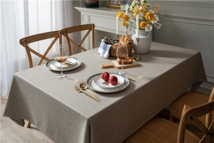 Close-up of linen-textured rectangle tablecloth showing fabric drape and weave