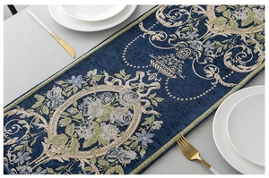Detail of European jacquard chenille table runner with floral embroidery and tassel fringe